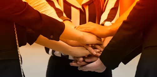 Corporate sales team hands stacked meeting