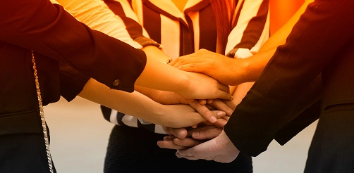 Corporate sales team hands stacked meeting